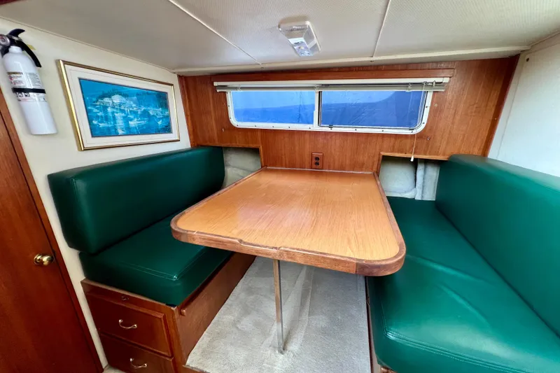 Slide: The Image of Open refrigerator in 1985 Tollycraft 48 Cockpit Motor Yacht kitchen, showing shelves and storage. - 100
