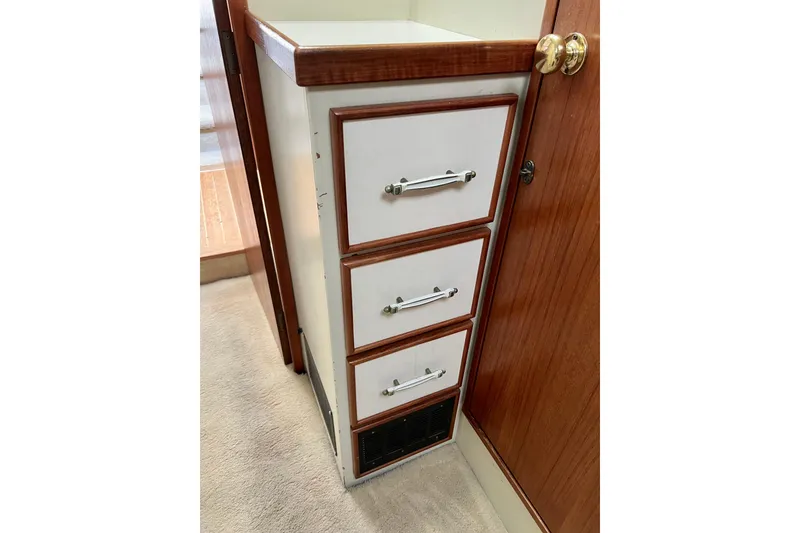 Slide: The Image of Closet interior of 1985 Tollycraft 48 Cockpit Motor Yacht with red jackets and storage. - 109