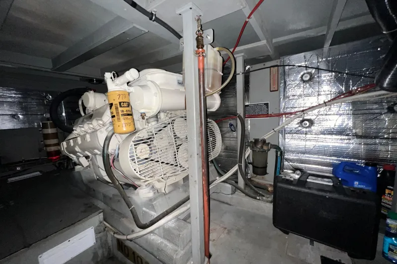 Slide: The Image of Engine room of 1985 Tollycraft 48 Cockpit Motor Yacht, featuring a Caterpillar engine. - 117