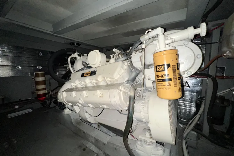 Slide: The Image of Engine room of 1985 Tollycraft 48 Cockpit Motor Yacht with visible machinery and equipment. - 118