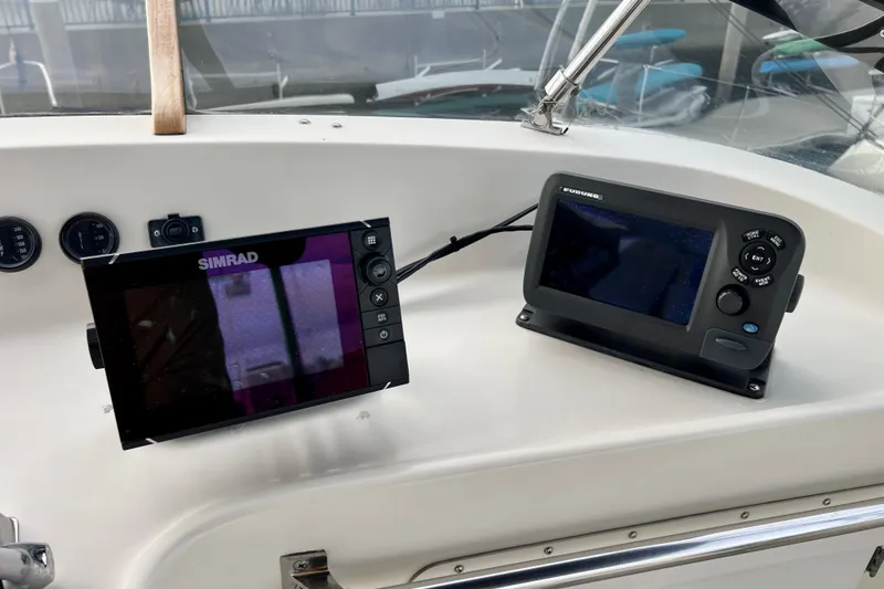 Slide: The Image of Steering wheel and controls of 1985 Tollycraft 48 Cockpit Motor Yacht. - 49