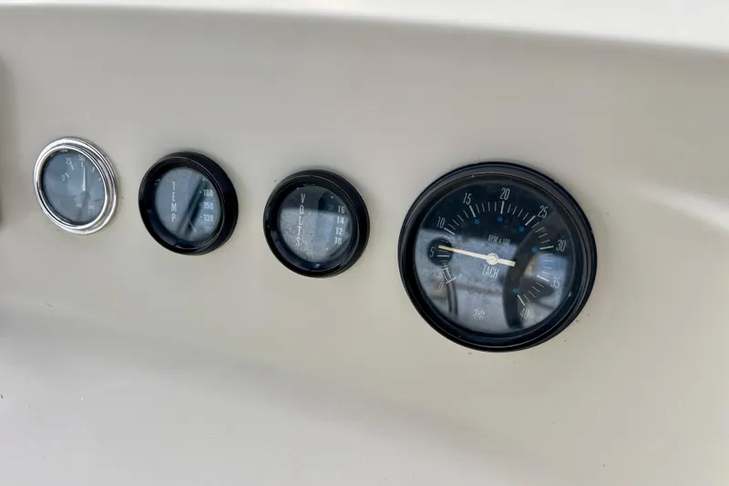 Slide: The Image of Dashboard gauges of a 1985 Tollycraft 48 Cockpit Motor Yacht. - 51