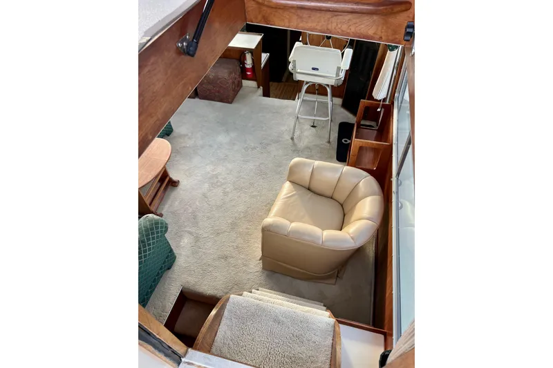 Slide: The Image of 1985 Tollycraft 48 Cockpit Motor Yacht door with window and blue cover. - 53
