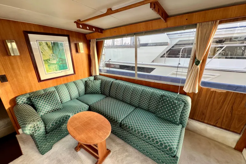 Slide: The Image of Interior of 1985 Tollycraft 48 Cockpit Motor Yacht with plush seating and nautical decor. - 59