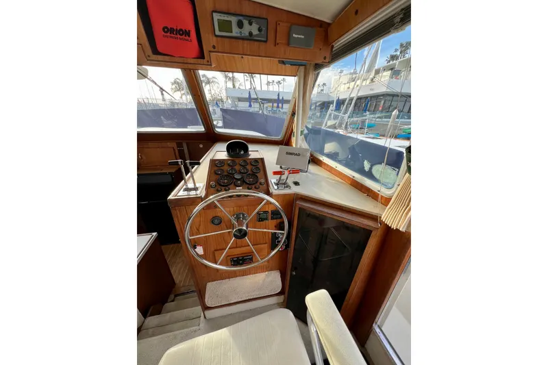 Slide: The Image of Control panel of a 1985 Tollycraft 48 Cockpit Motor Yacht with gauges and switches. - 67