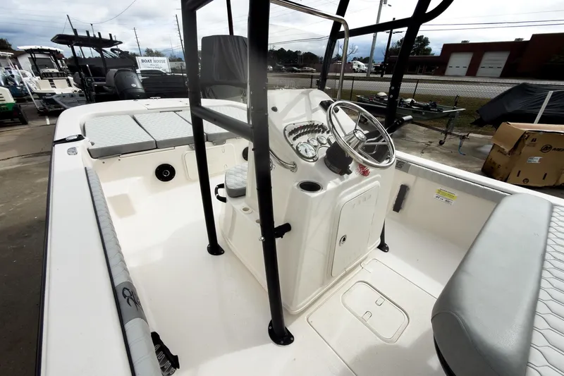 Slide: The Image of 2026 Carolina Skiff 21 LS boat interior with steering console and seating. - 14