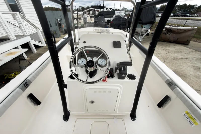Slide: The Image of 2026 Carolina Skiff 21 LS boat interior with steering console and gauges. - 15