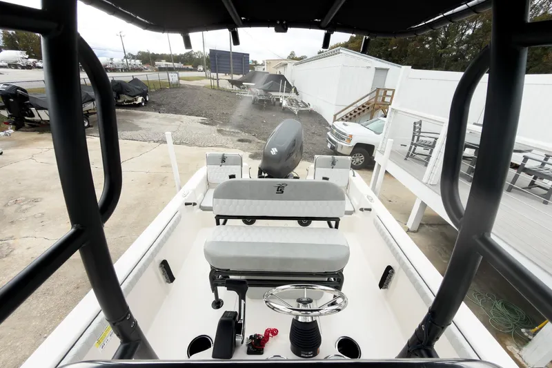 Slide: The Image of 2026 Carolina Skiff 21 LS boat interior with steering wheel and seating. - 17