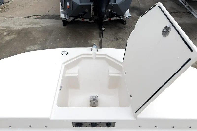 Slide: The Image of Open storage compartment on 2026 Carolina Skiff 21 LS boat deck. - 27