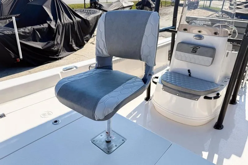 Slide: The Image of 2026 Carolina Skiff 21 LS boat interior with cushioned seating and console. - 30