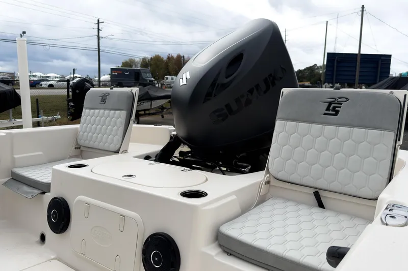 Slide: The Image of 2026 Carolina Skiff 21 LS boat interior with Suzuki engine, featuring comfortable seating. - 5