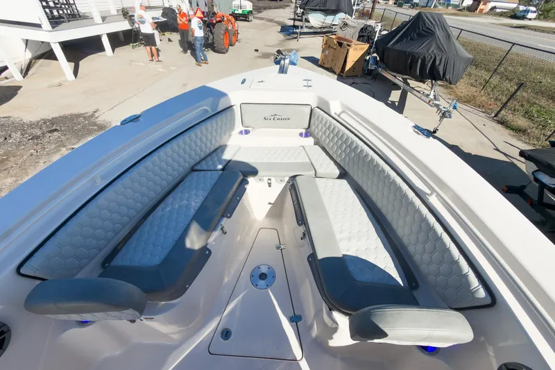 Slide: The Image of 2026 Sea Chaser 24 HFC DE boat interior with cushioned seating and modern design. - 18