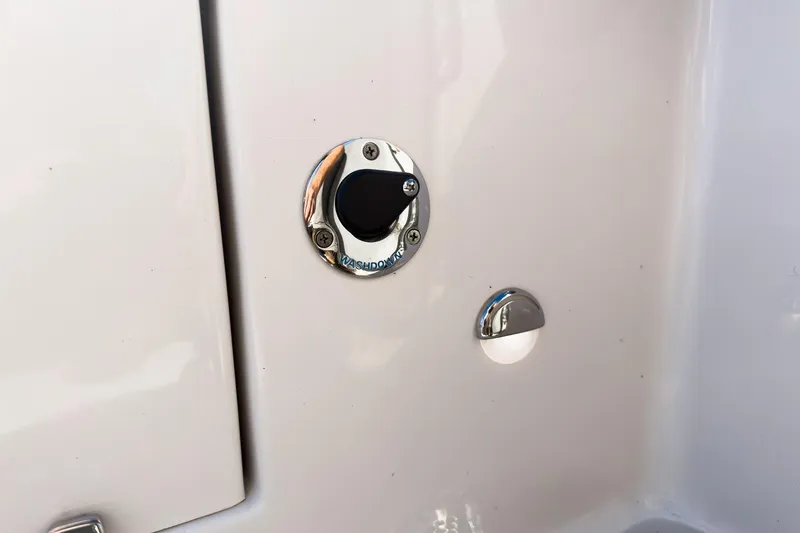 Slide: The Image of 2026 Sea Chaser 24 HFC DE boat washdown fitting and cover detail. - 33