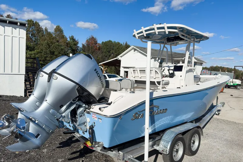 Slide: The Image of 2026 Sea Chaser 24 HFC DE boat with Honda outboard motor on trailer. - 9