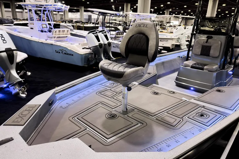 Slide: The Image of 2026 Excel 230 Bay Pro Elite boat interior with seating and deck details. - 12