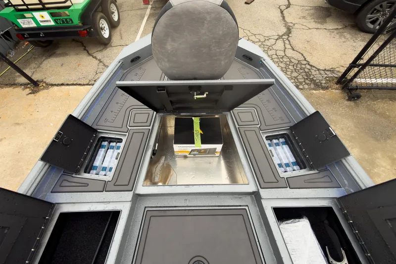 Slide: The Image of 2026 Excel Bay Pro Elite 230 boat interior with storage compartments open. - 25