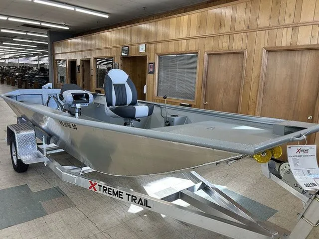 The Image of 2026 XTREME BOATS River Skiff 1648SS Tunnel on trailer in showroom. - 1