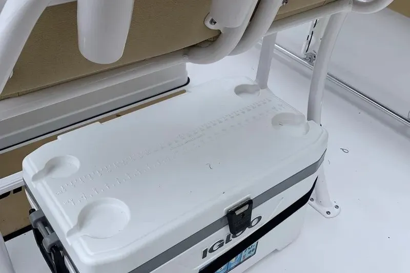 Slide: The Image of White cooler on 2025 Sportsman Heritage 231 Center Console boat deck. - 11