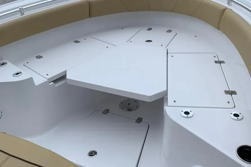 Slide: The Image of 2025 Sportsman Heritage 231 Center Console boat interior with storage compartments. - 3