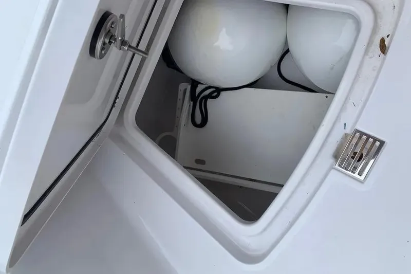 Slide: The Image of Open storage compartment on 2025 Sportsman Heritage 231 Center Console boat. - 5