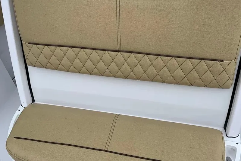 Slide: The Image of 2025 Sportsman Heritage 231 Center Console seat with beige diamond-stitched upholstery. - 6