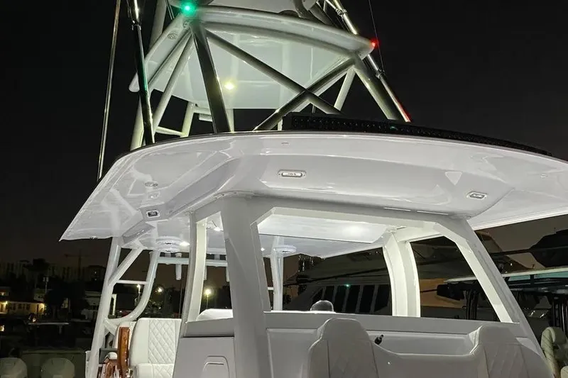 Slide: The Image of 2023 Freeman 47 boat on calm water under clear blue sky. - 3