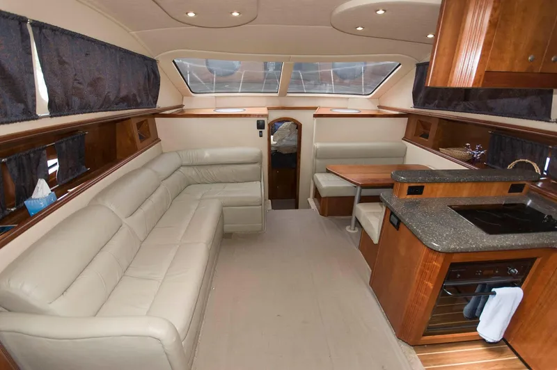 Slide: The Image of Interior of 2007 Cruisers Yachts 415 Express Motoryacht with leather sofa and kitchenette. - 12