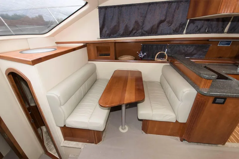 Slide: The Image of Interior of 2007 Cruisers Yachts 415 Express Motoryacht with dining table. - 14