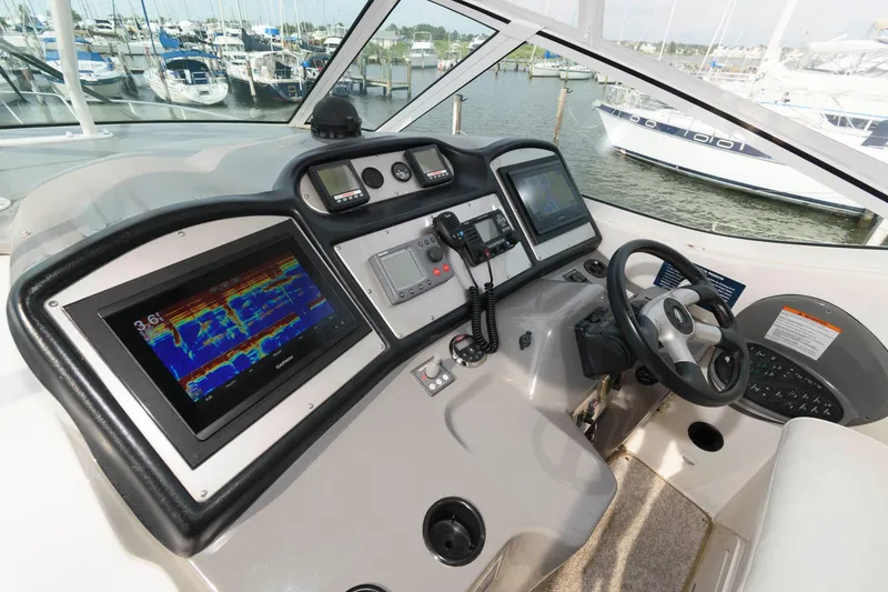 Slide: The Image of 2007 Cruisers Yachts 415 Express Motoryacht helm station in marina. - 6