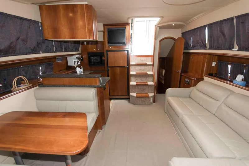 Slide: The Image of Interior of 2007 Cruisers Yachts 415 Express Motoryacht with sofa and kitchen. - 11