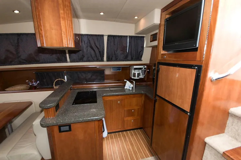 Slide: The Image of Interior of 2007 Cruisers Yachts 415 Express Motoryacht with kitchen. - 16