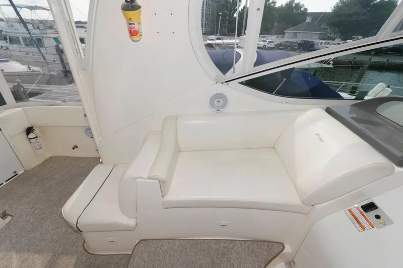 Slide: The Image of Interior of 2007 Cruisers Yachts 415 Express Motoryacht with white seating area. - 7