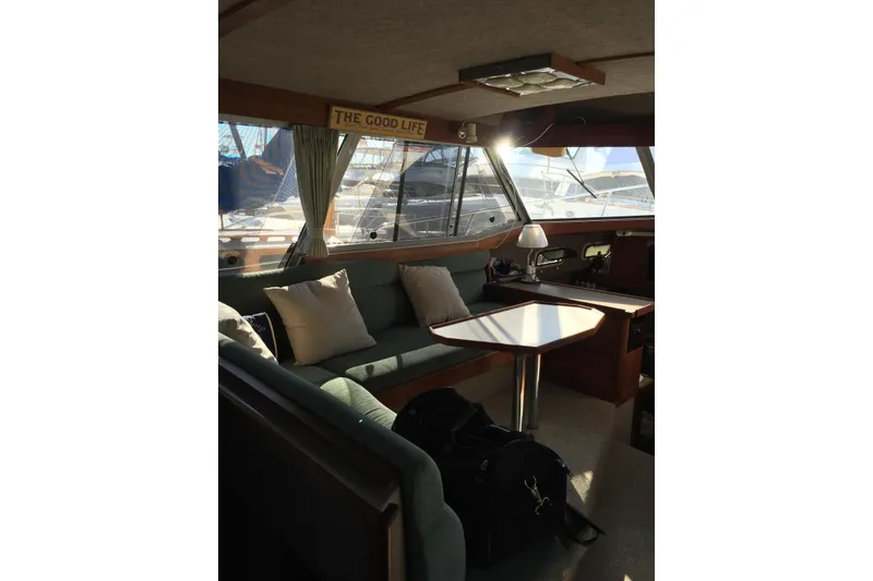 Slide: The Image of Interior of 1983 Bayliner 3270 Explorer with cozy seating and table. - 14