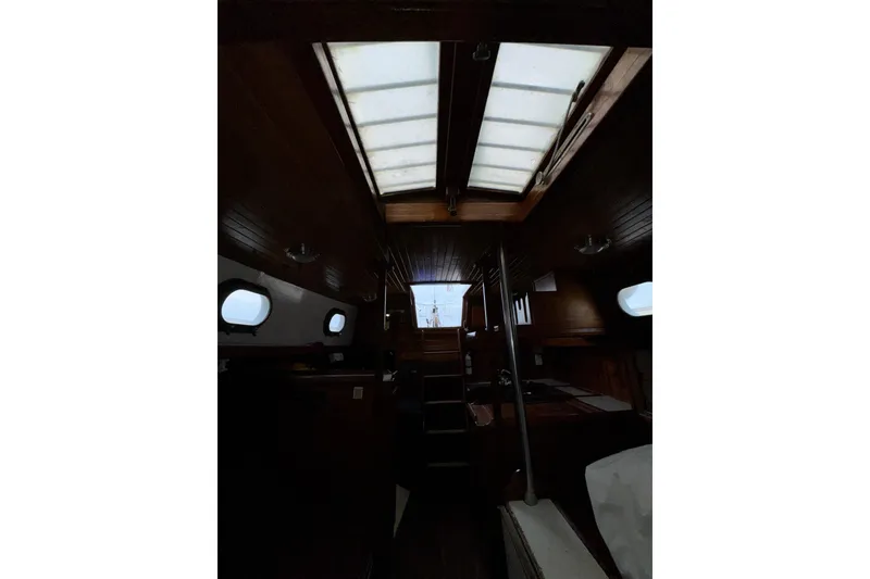 Slide: The Image of Interior of 1977 Westsail Cutter sailboat with wooden finish and skylight. - 31