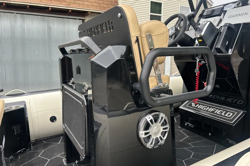 Slide: The Image of 2024 Highfield Sport 560 boat interior with steering console and seating. - 3