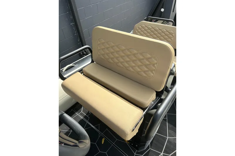 Slide: The Image of 2024 Highfield Sport 560 boat seats with beige diamond-stitched upholstery. - 5