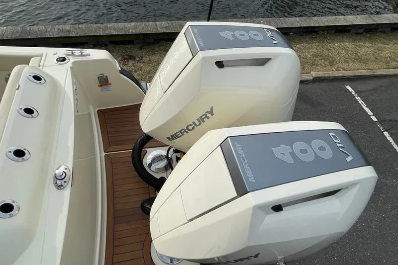 Slide: The Image of 2026 Chris-Craft 310 Catalina with dual Mercury 400 V10 engines, docked by the water. - 12