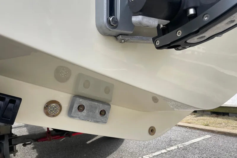 Slide: The Image of 2026 Chris-Craft 310 Catalina boat hull with underwater lights and hardware. - 13