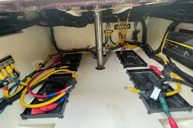 Slide: The Image of Engine compartment of 2026 Chris-Craft 310 Catalina with wiring and battery trays. - 16