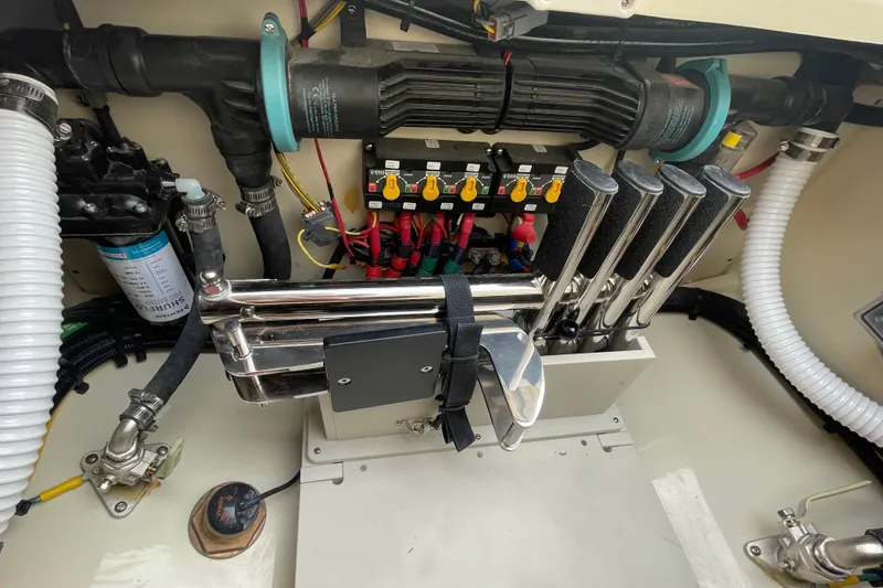Slide: The Image of Engine compartment of 2026 Chris-Craft 310 Catalina, showcasing mechanical components and wiring. - 17