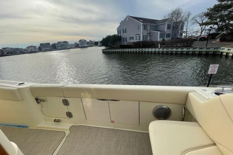 Slide: The Image of 2026 Chris-Craft 310 Catalina boat interior with waterfront view and nearby houses. - 22