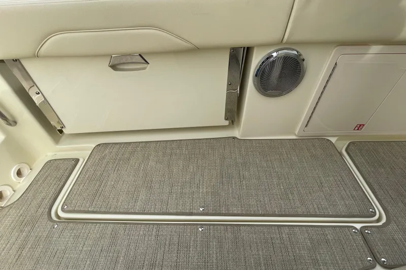 Slide: The Image of 2026 Chris-Craft 310 Catalina interior with speaker and storage compartments. - 28