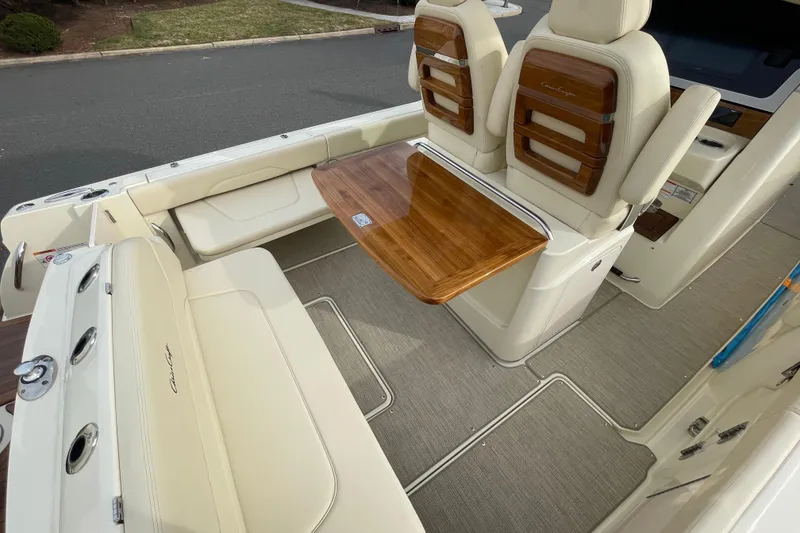 Slide: The Image of 2026 Chris-Craft 310 Catalina interior with elegant seating and wooden table. - 31
