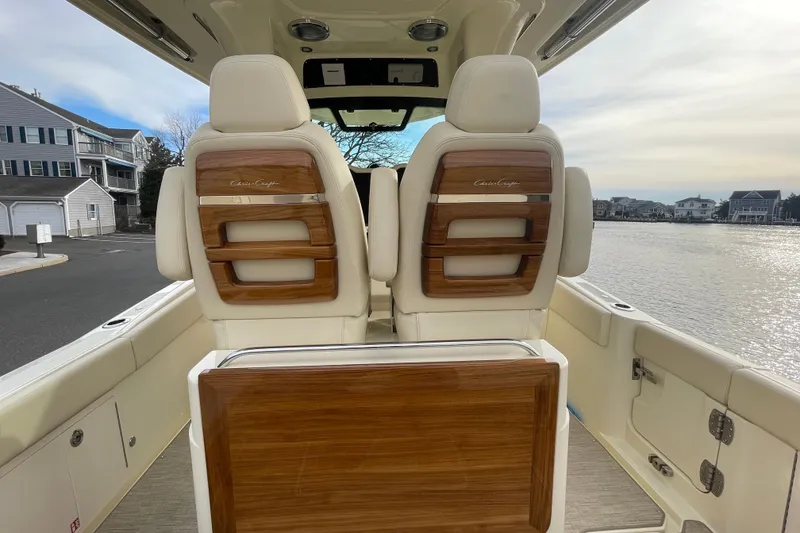 Slide: The Image of 2026 Chris-Craft 310 Catalina boat interior with elegant wood and leather seating. - 32