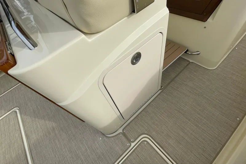 Slide: The Image of 2026 Chris-Craft 310 Catalina interior detail with beige upholstery and sleek design. - 44
