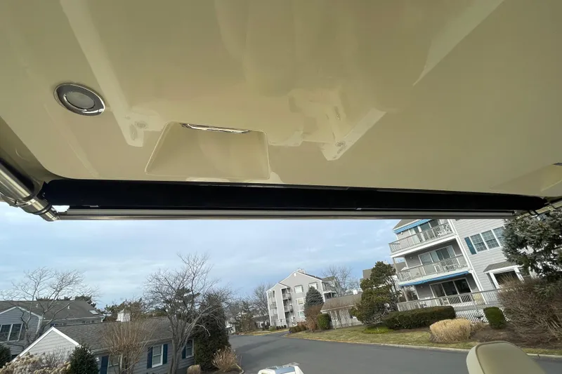 Slide: The Image of 2026 Chris-Craft 310 Catalina boat interior with view of residential street. - 50