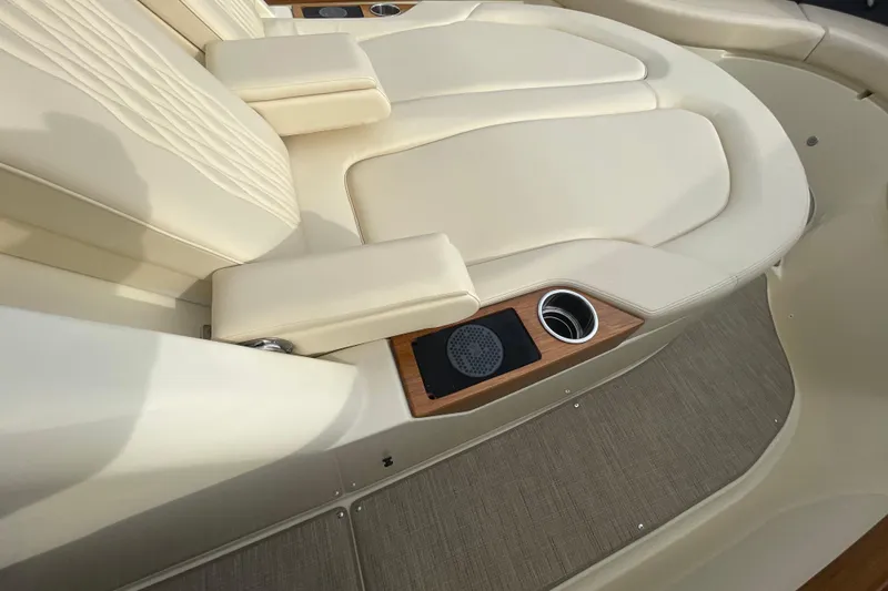 Slide: The Image of Luxurious seating on 2026 Chris-Craft 310 Catalina boat with cup holder and speaker. - 55
