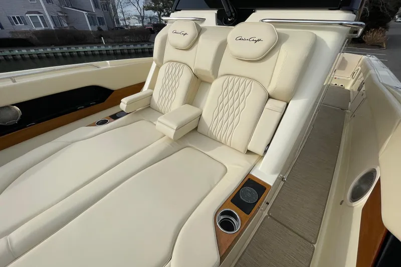 Slide: The Image of 2026 Chris-Craft 310 Catalina boat with luxurious cream leather seating and cup holders. - 62