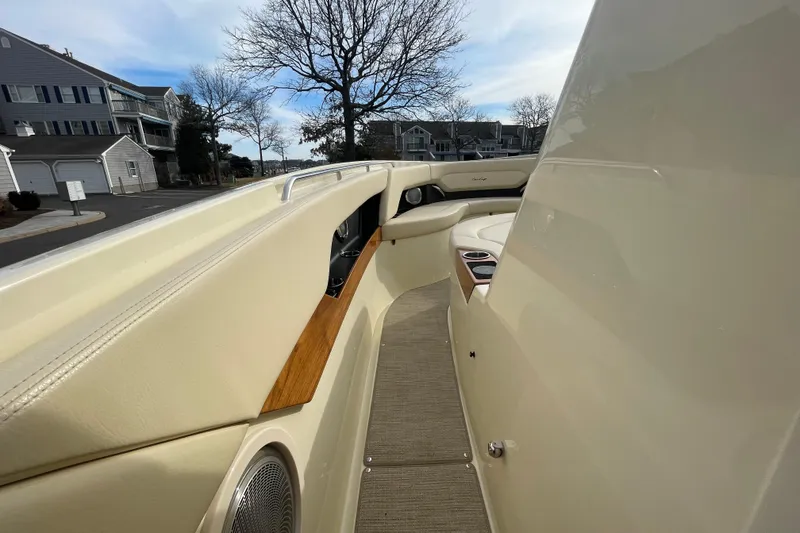 Slide: The Image of 2026 Chris-Craft 310 Catalina boat interior with beige seating and wood accents. - 64