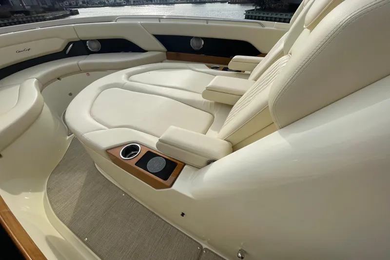 Slide: The Image of Luxurious seating on 2026 Chris-Craft 310 Catalina boat, featuring elegant cream upholstery. - 67